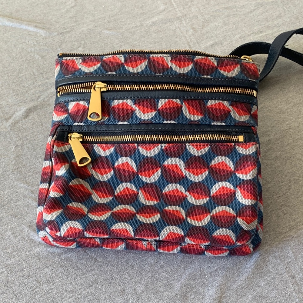 Fossil canvas crossbody with brass hardware.